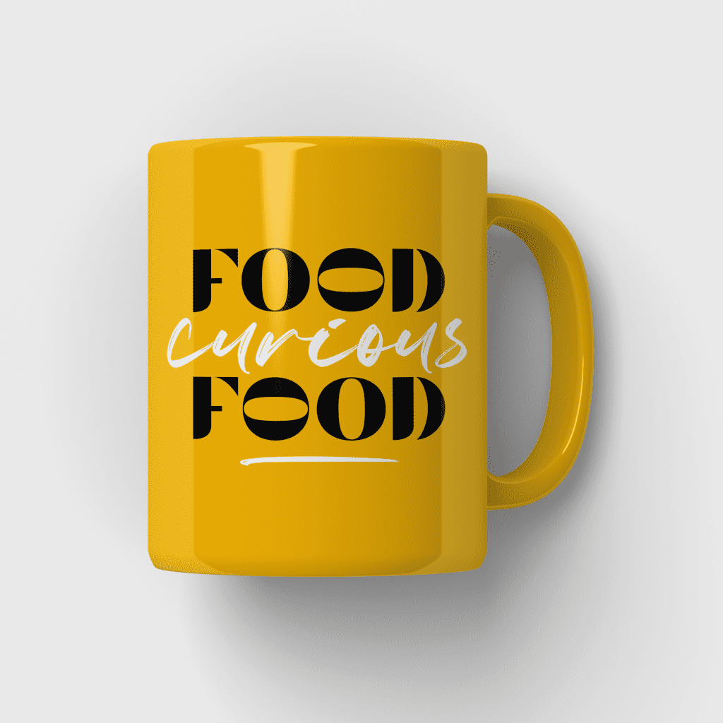 Food consultant branding for Food Curious Food applied as a logo in black and white on a yellow mug.
