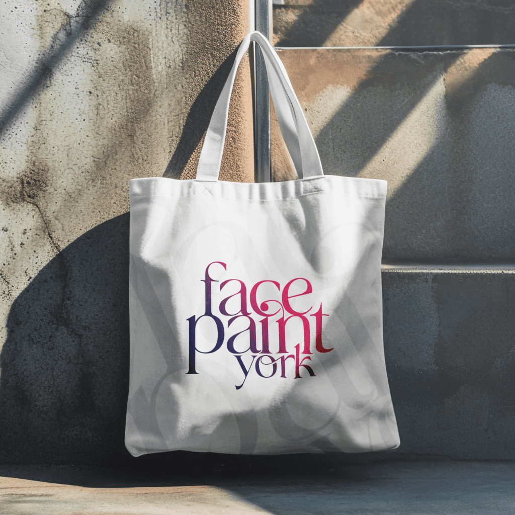 Cavas tote bag showing large logo design for Face Paint York in brand colours pink and purple