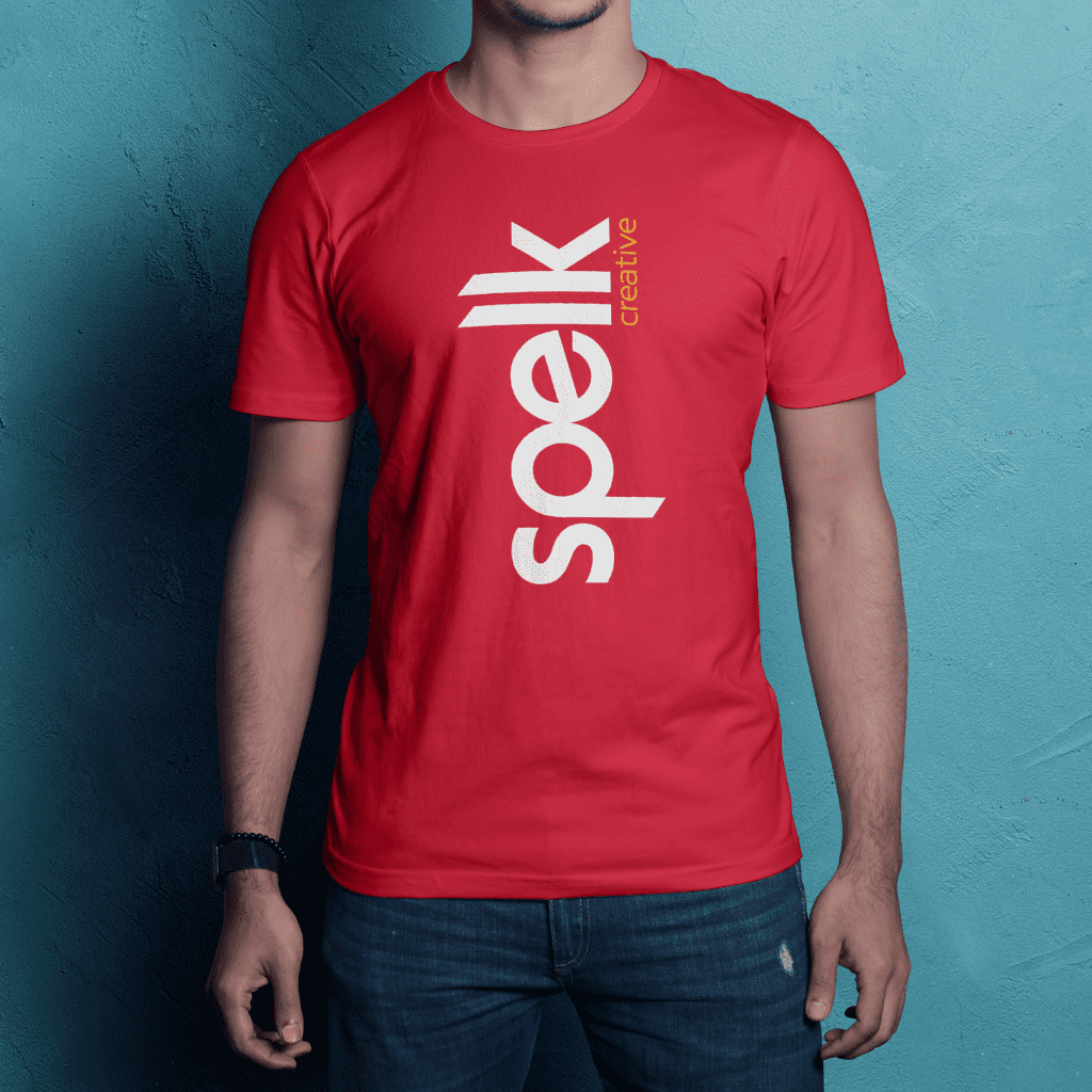 Man wearing a red t shirt with the vertical version of the Spelk logo printed ont he front, part of the brand collateral created in the brand identity project
