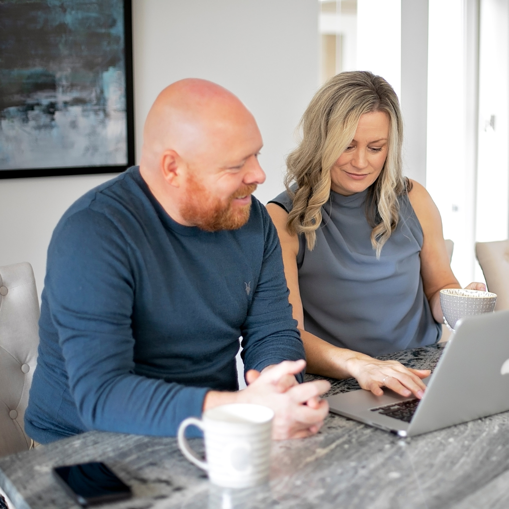 Chris and Jen from Mint Sauce Media planning a web design project together over coffee