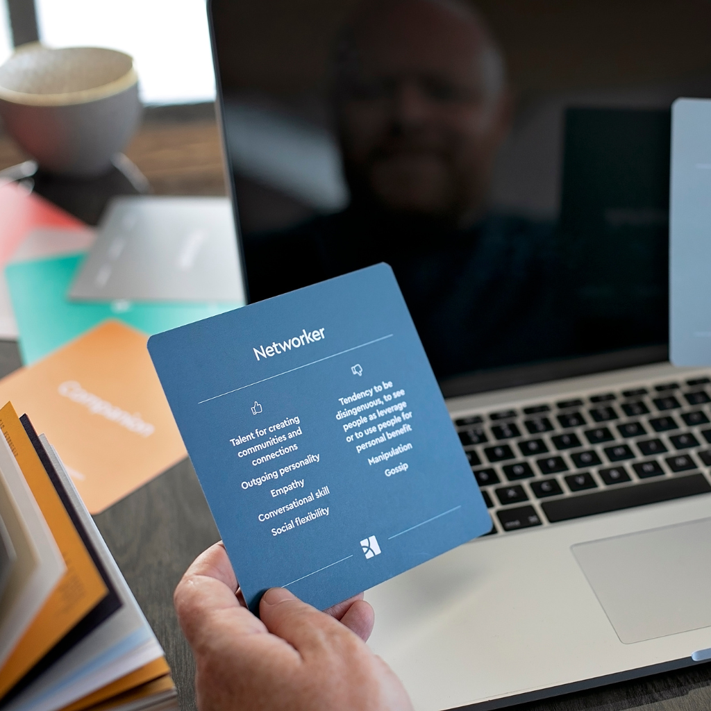 Brand designer in York reviewing brand differentiation and personality archetype cards during a branding strategy session