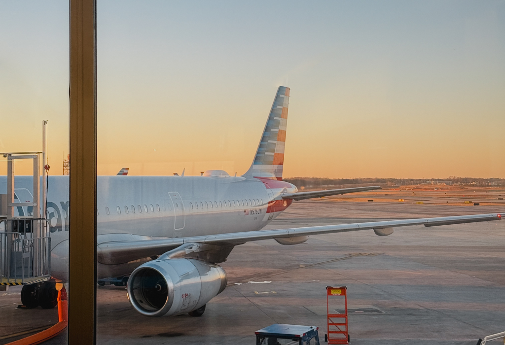 View of the rear of an aeroplane parked on a runway as holidaymakers are about to travel
