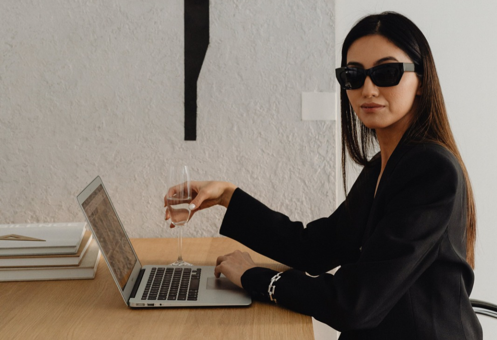 women sat at open laptop getting contact page ideas